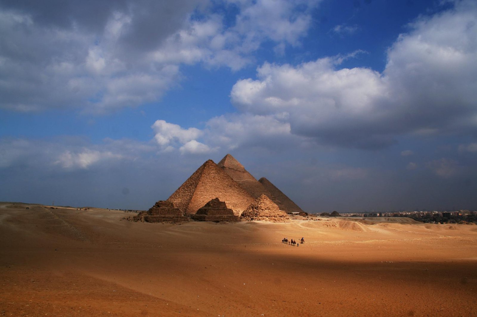 a group of pyramids in a desert