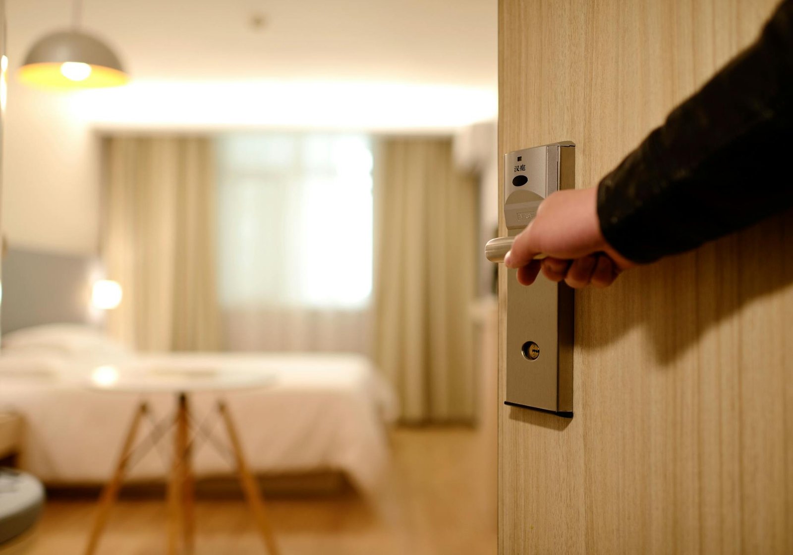 https://www.pexels.com/photo/person-holding-on-door-lever-inside-room-271639/