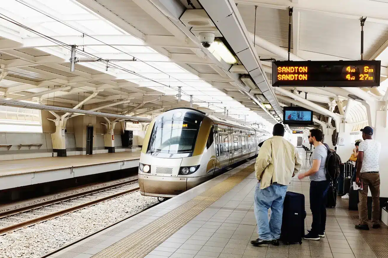 Passengers wait on the platform at OR Tambo Airport, Johannesburg, as the Gautrain arrives. The Gautrain (short for Gauteng Province train) is a modern mass rapid transit railway system linking Pretoria, Johannesburg,